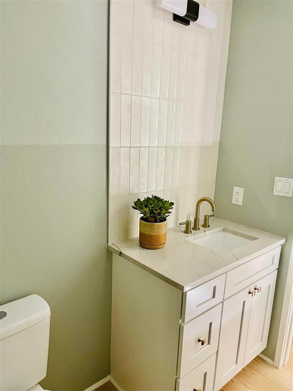 bathroom with vanity and toilet