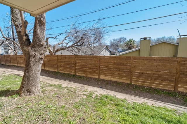 view of yard with a fenced backyard