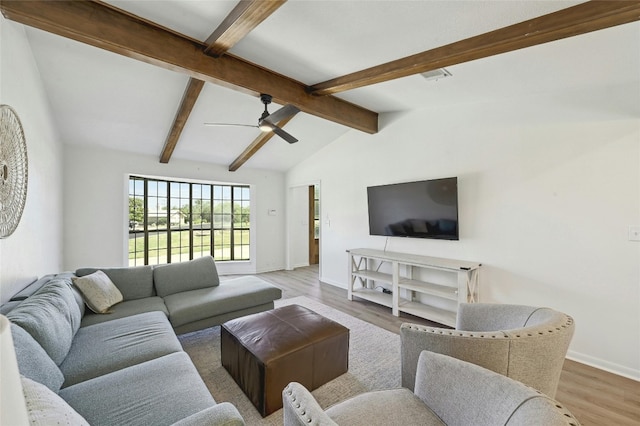 608 Sombrero Dr, Horseshoe Bay, TX 78657 - living room featuring vaulted ceiling with beams, ceiling fan, wood finished floors, visible vents, and baseboards