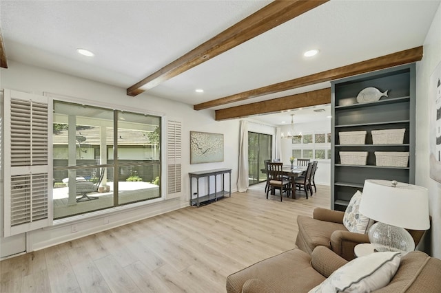 608 Sombrero Dr, Horseshoe Bay, TX 78657 - living area featuring a chandelier, recessed lighting, beamed ceiling, and wood finished floors