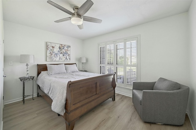 608 Sombrero Dr, Horseshoe Bay, TX 78657 - bedroom with light wood-style flooring, baseboards, and ceiling fan