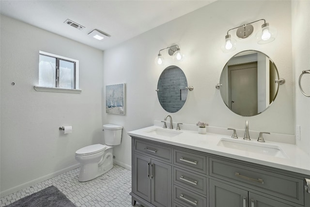 608 Sombrero Dr, Horseshoe Bay, TX 78657 - full bath with visible vents, a sink, toilet, and double vanity