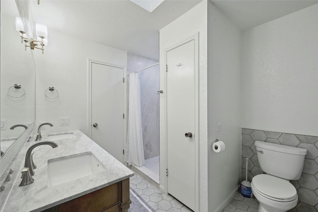 608 Sombrero Dr, Horseshoe Bay, TX 78657 - bathroom with toilet, a shower stall, and a sink