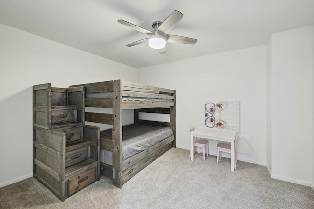 608 Sombrero Dr, Horseshoe Bay, TX 78657 - carpeted bedroom with baseboards and a ceiling fan