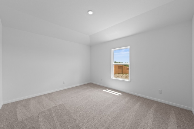 spare room with carpet floors and baseboards