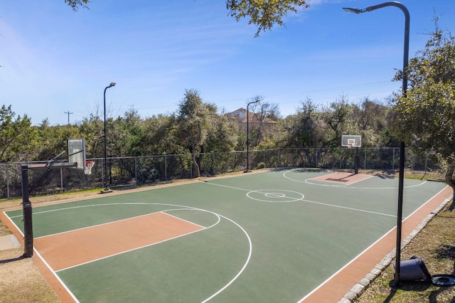 view of sport court featuring community basketball court and fence