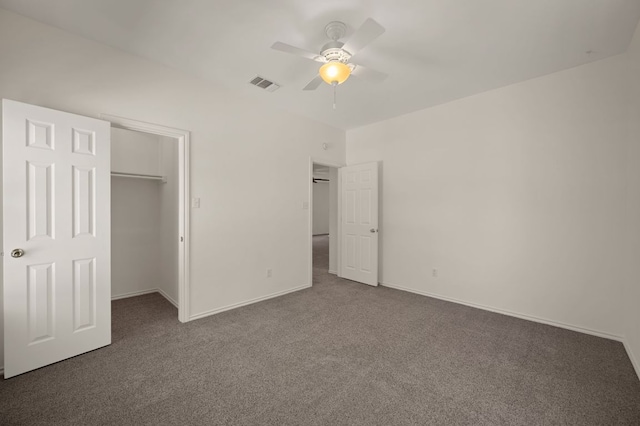 unfurnished bedroom featuring carpet floors, a closet, visible vents, ceiling fan, and baseboards