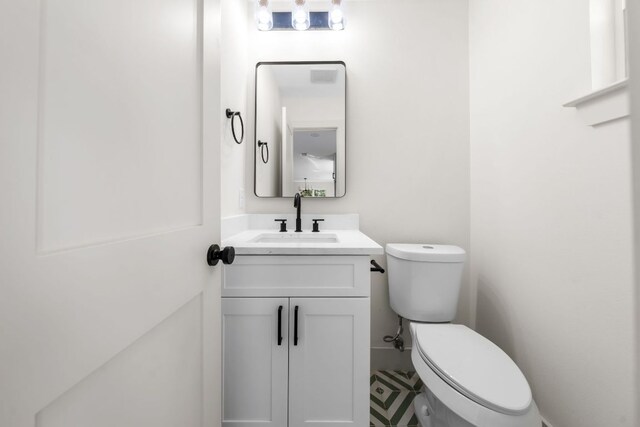 half bath with toilet and vanity