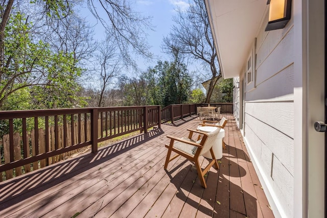 wooden deck with outdoor dining space