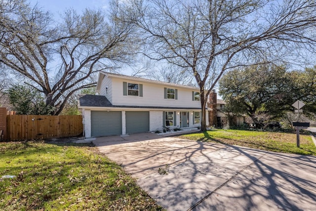 view of front of home with driveway, an attached garage, fence, a front lawn, and brick siding