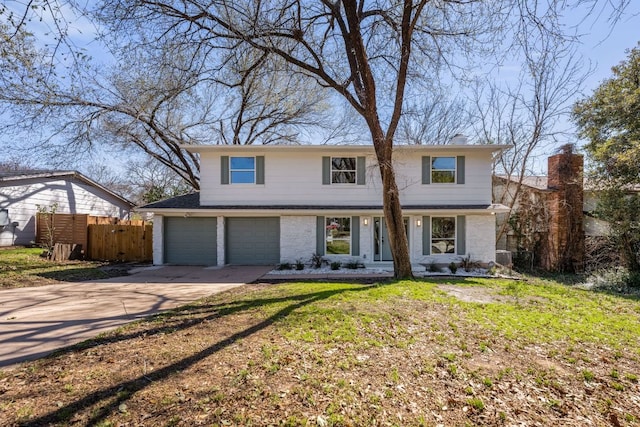 view of front facade with brick siding, a chimney, concrete driveway, an attached garage, and fence