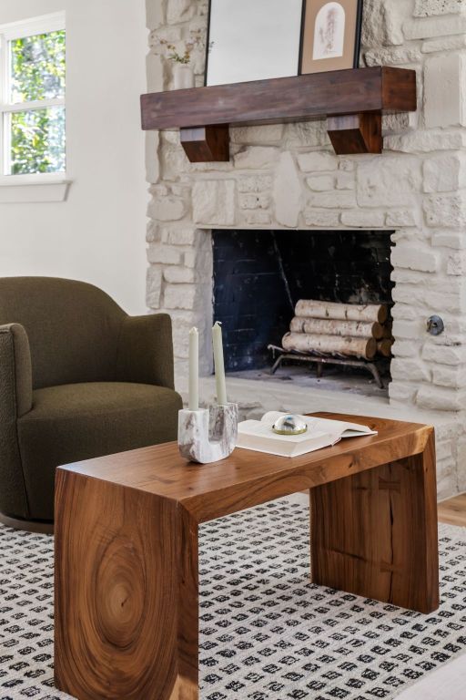 interior details featuring a stone fireplace