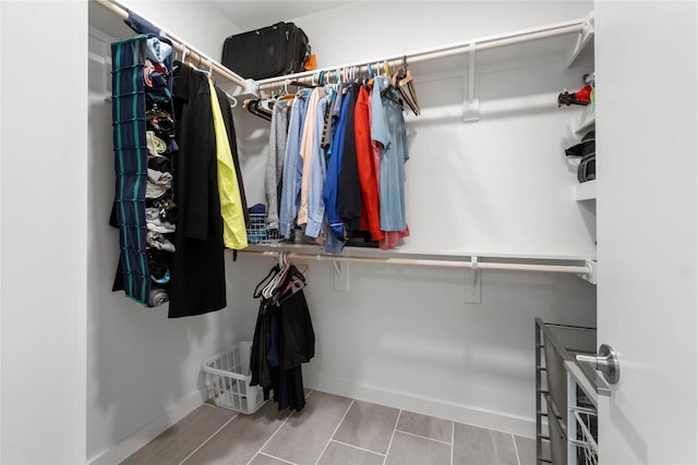 spacious closet with tile patterned floors