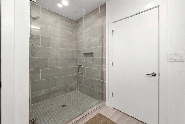 bathroom featuring a stall shower and tile patterned floors