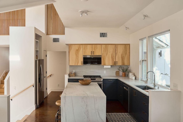 kitchen with visible vents, appliances with stainless steel finishes, light countertops, and a sink