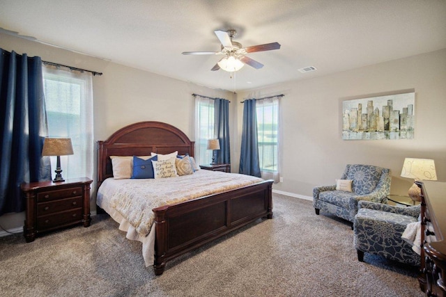 bedroom with carpet, visible vents, ceiling fan, and baseboards