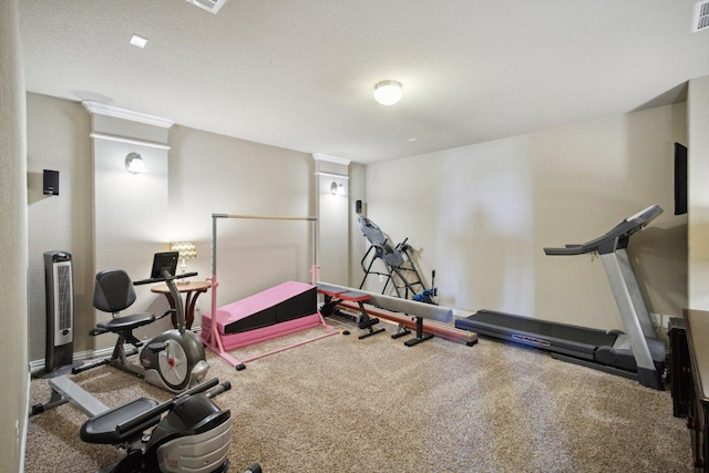 exercise room with carpet and visible vents