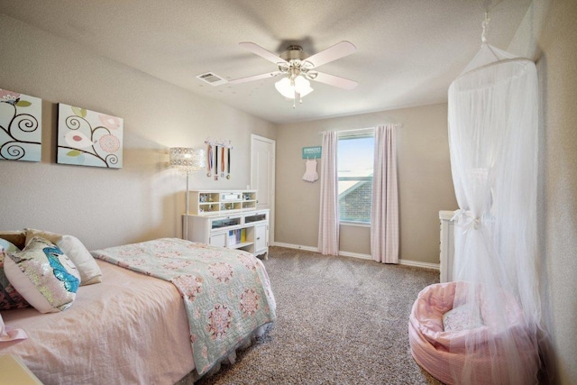 carpeted bedroom featuring visible vents, ceiling fan, and baseboards