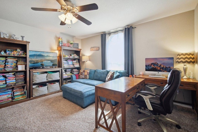 carpeted home office featuring ceiling fan and a textured ceiling