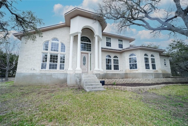 view of front of home with a front lawn