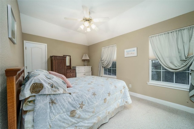 bedroom with lofted ceiling, carpet floors, ceiling fan, and baseboards