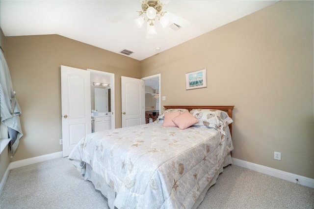 bedroom with light carpet, baseboards, visible vents, and connected bathroom