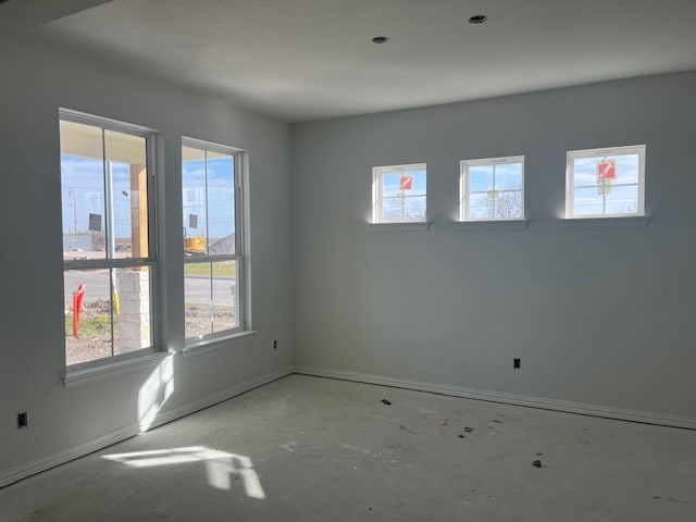 spare room with plenty of natural light