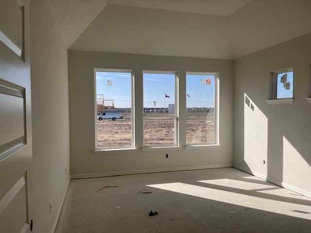 empty room featuring baseboards