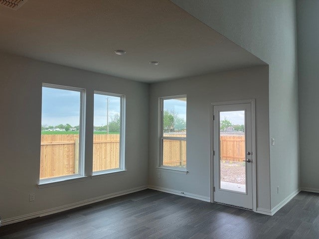 503 Ansley Ct, Taylor, TX 76574 - empty room with dark wood-type flooring and baseboards