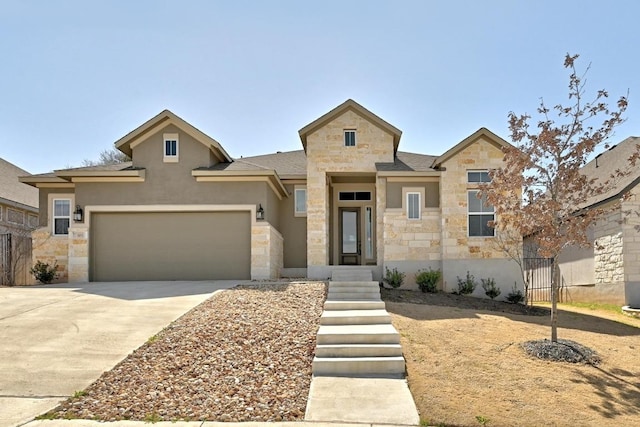 view of front facade featuring concrete driveway, a garage, and stone siding