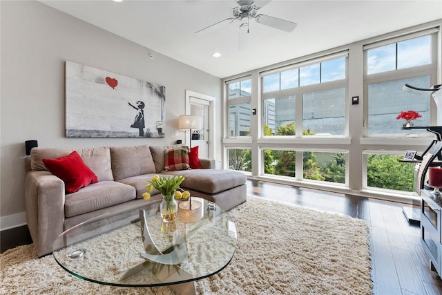 living room with wood-type flooring, baseboards, ceiling fan, and recessed lighting