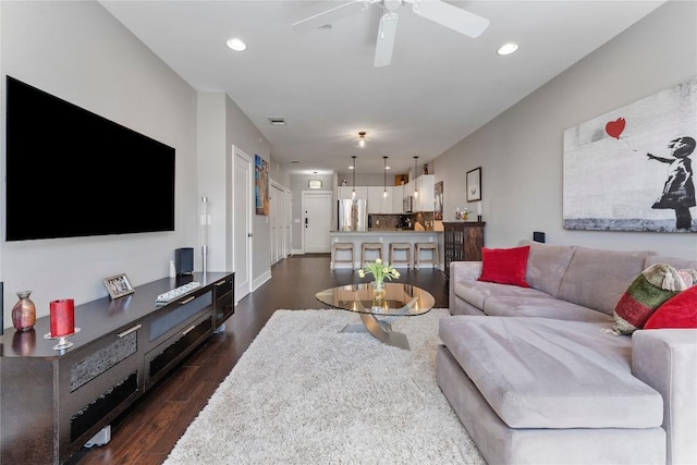 living room with dark wood-style flooring, recessed lighting, visible vents, a ceiling fan, and baseboards