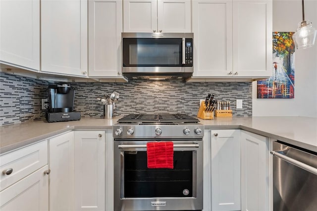 kitchen with stainless steel appliances and white cabinetry