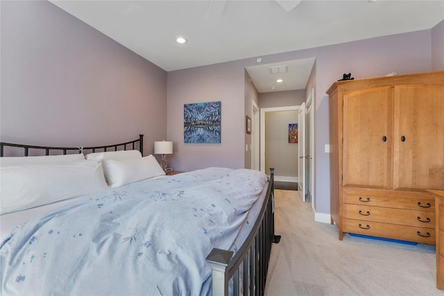 bedroom featuring light carpet, recessed lighting, visible vents, and baseboards