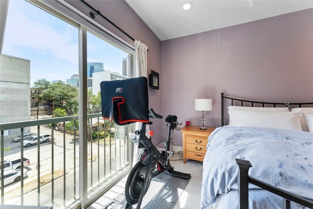 bedroom featuring carpet floors and a city view