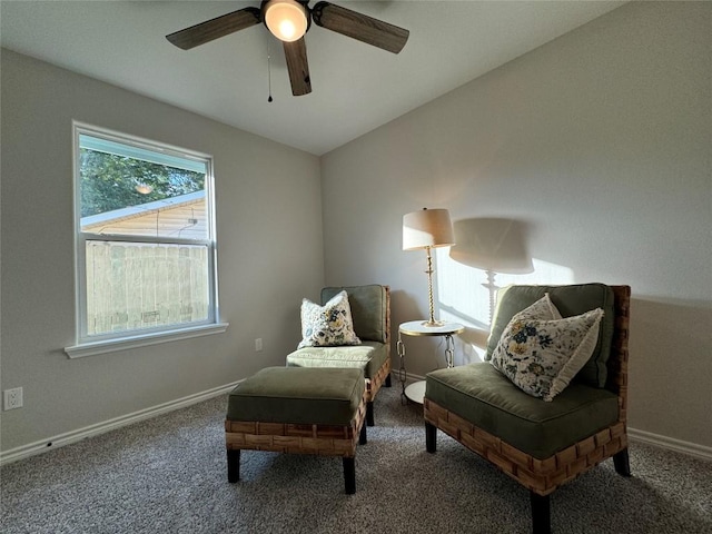 sitting room featuring a ceiling fan, carpet, lofted ceiling, and baseboards