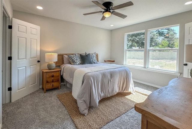 bedroom featuring baseboards, a ceiling fan, light colored carpet, and recessed lighting