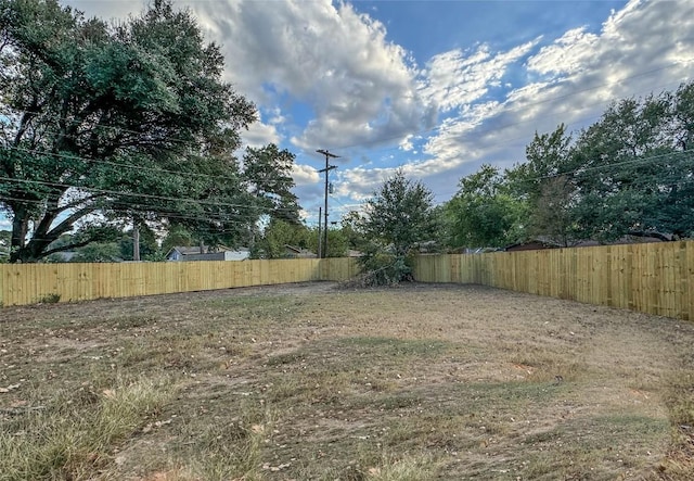 view of yard with a fenced backyard