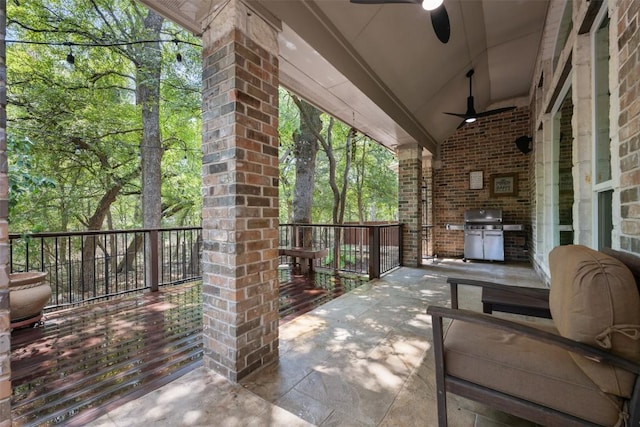 view of patio / terrace featuring ceiling fan, grilling area, and an outdoor kitchen