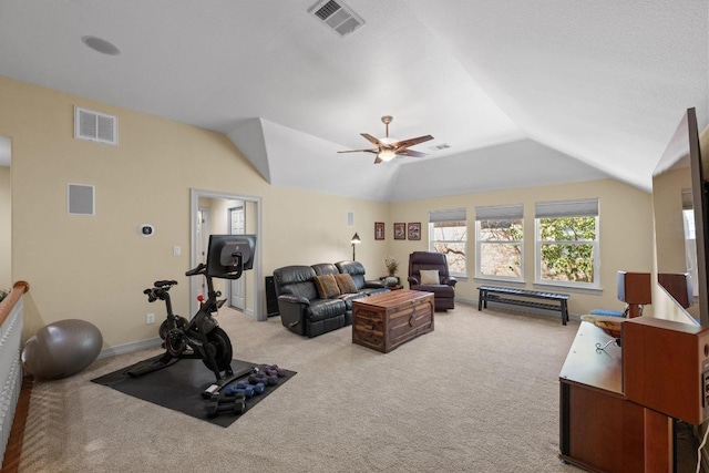 workout room featuring lofted ceiling, visible vents, and light colored carpet