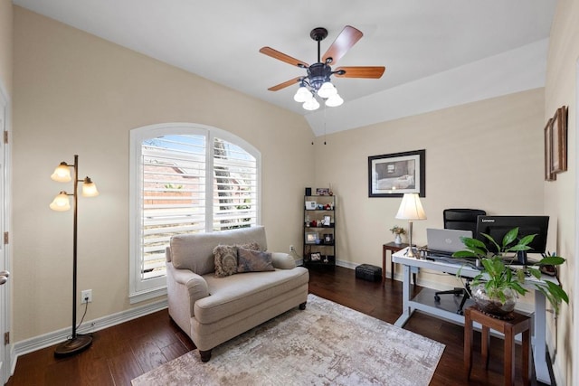 office space with a ceiling fan, lofted ceiling, baseboards, and wood finished floors