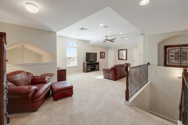 carpeted living area featuring a ceiling fan, recessed lighting, visible vents, and baseboards