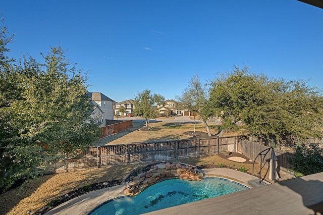 view of swimming pool with a fenced in pool and a fenced backyard