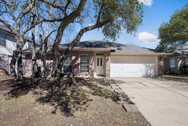 ranch-style home with a garage, concrete driveway, and brick siding