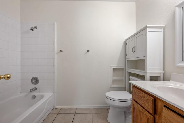 bathroom featuring toilet, washtub / shower combination, vanity, tile patterned flooring, and baseboards