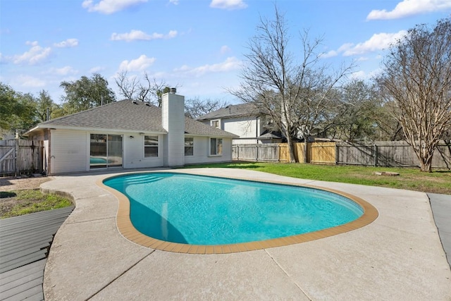 view of swimming pool with a fenced in pool, a patio area, a fenced backyard, and a yard