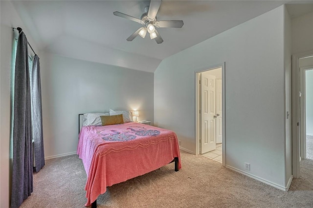 carpeted bedroom featuring a ceiling fan, lofted ceiling, and baseboards