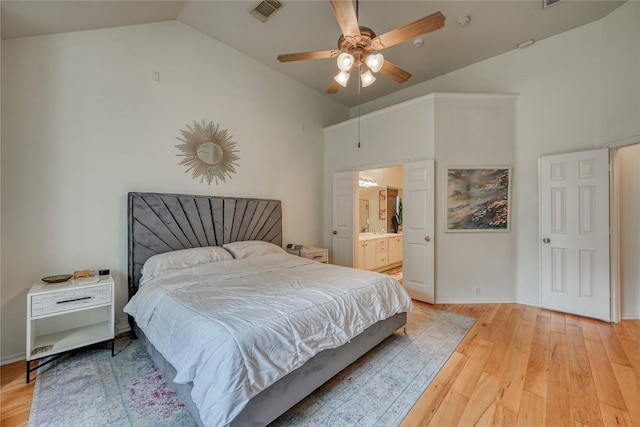 bedroom with ceiling fan, connected bathroom, visible vents, baseboards, and light wood-style floors