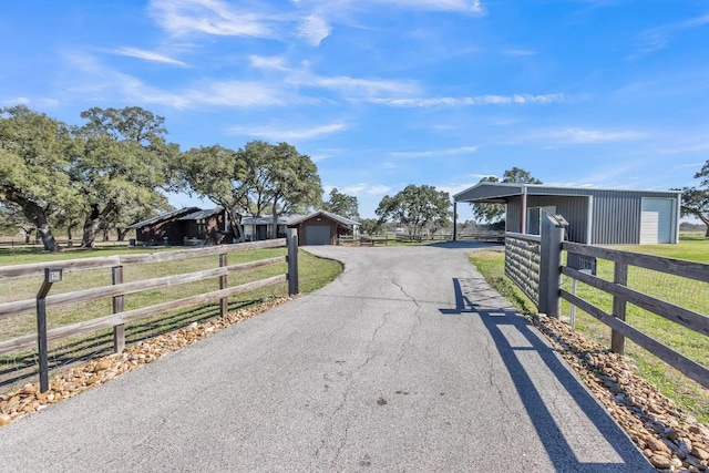 view of street with aphalt driveway