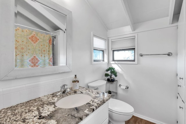 full bath featuring vanity, toilet, lofted ceiling with beams, and a shower with curtain